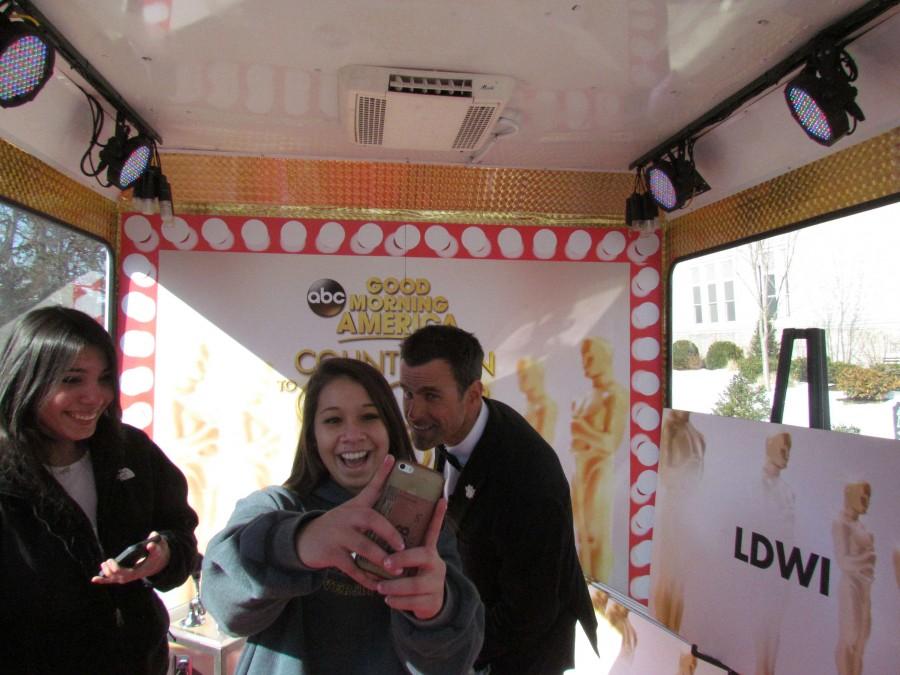 Junior Karen Ledesma takes a selfie with Cameron Mathison.