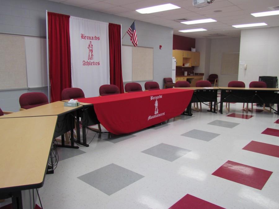 Community room set up for signing. 