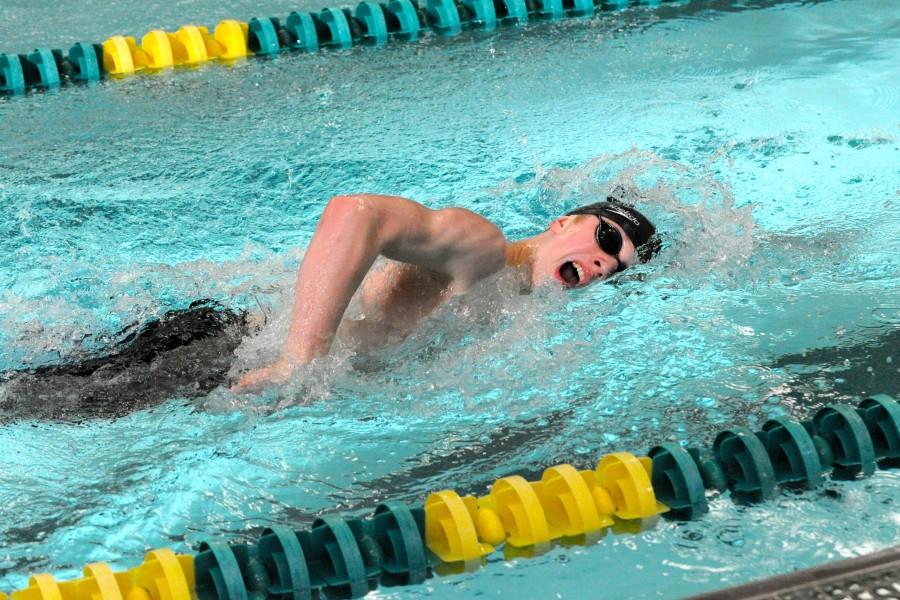 Alex Keil swimming to the finish line at a recent meet. 