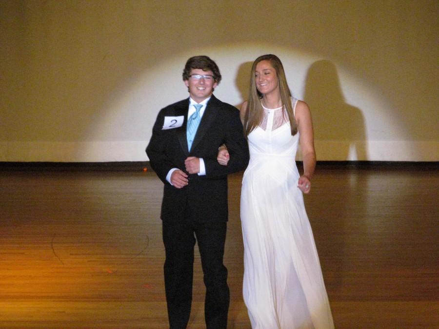 Troy Lavecchia strutting the stage with his escort Christina Reddi. 