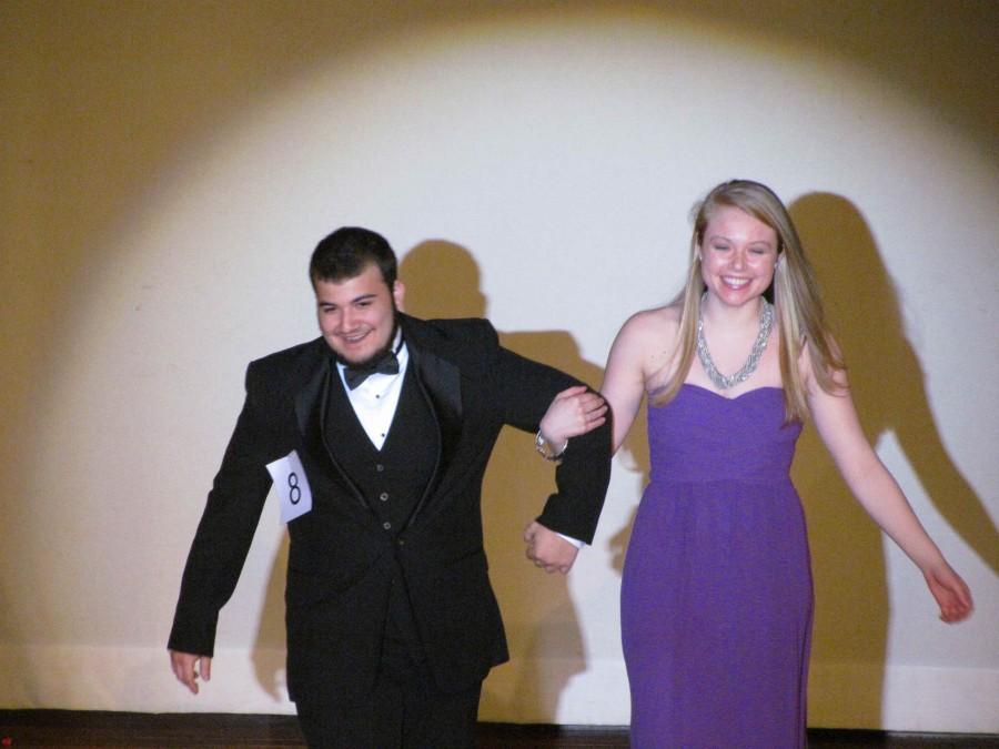 Dominick Destefano excited to begin the contest as he walks the runway with his escort Madigan Petrie. 