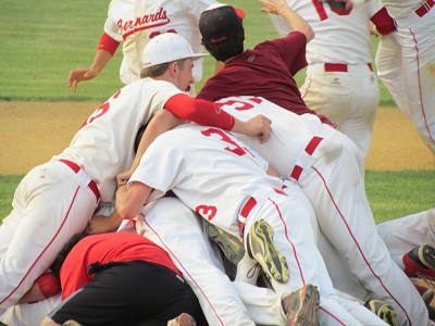 The team celebrates after the final out.