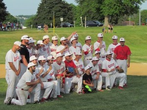The team poses with the trophy after winning their second consecutive sectionals championship.