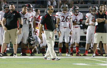 Head Coach Jon Simoneau (center) during a game against AL Johnson