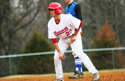 Senior Devin Rivera leads past first base