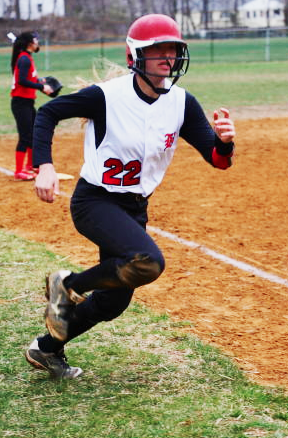 Junior Caroline Baratta rounds third base and heads home