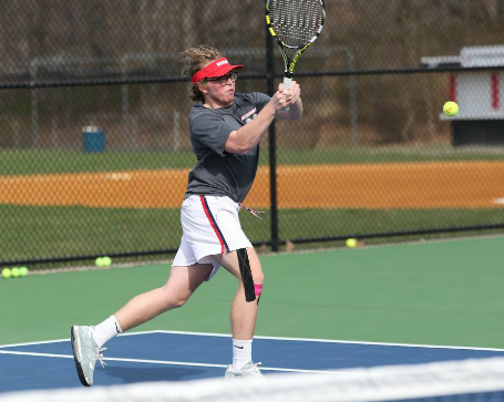 Senior Marshall Hespe backhands the ball