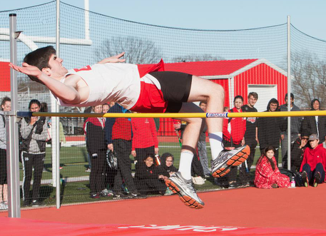 Junior Rob Peralta jumps over the pole in the pole vault