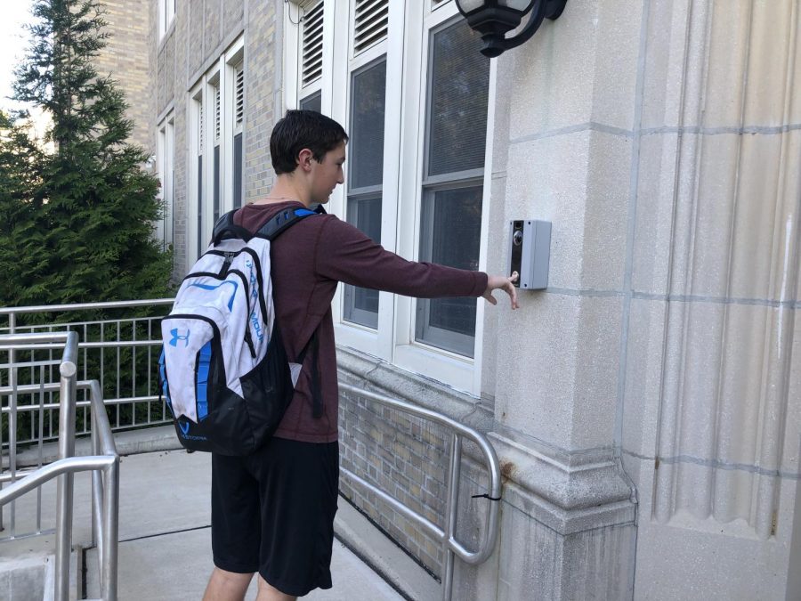 Student has to buzz into school after arriving late.