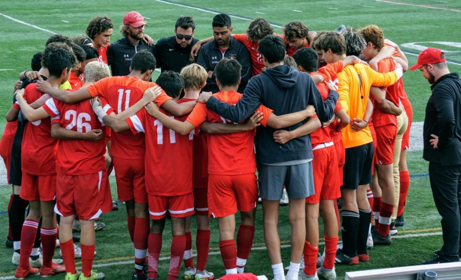 Team+huddle+before+vital+game+against+Hackettstown.