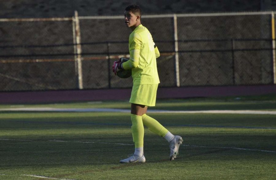 Senior goalie Giancarlo Acosta-Jimenez with the ball after making a save