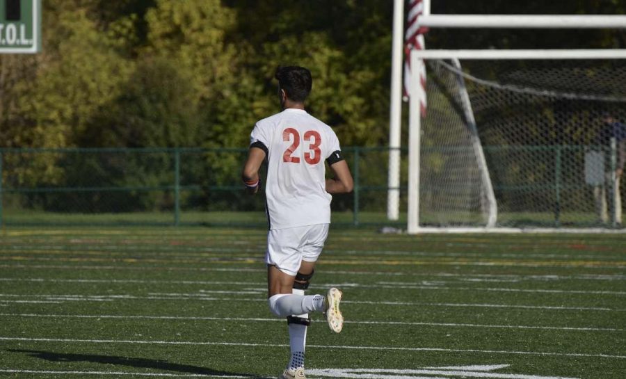 Number 23 Greg Ferreira running down the field during a game