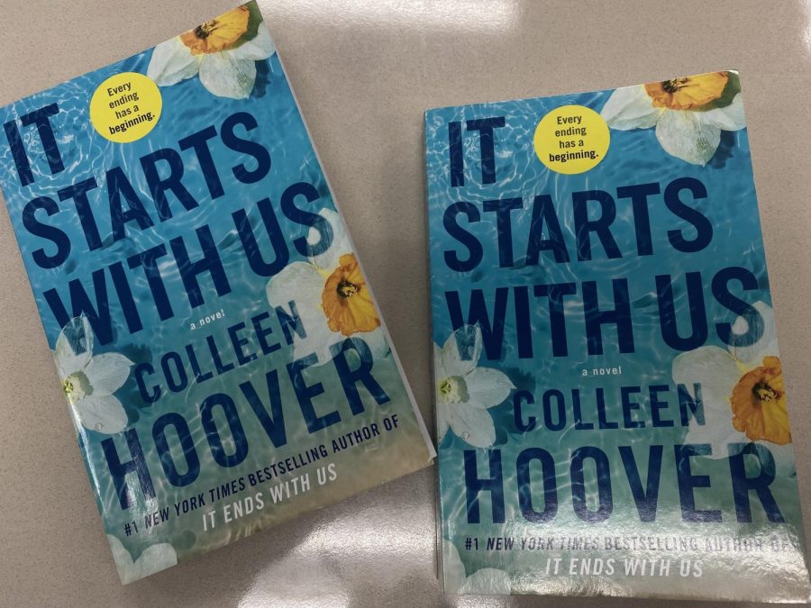Display of two copies of the book "It Starts With Us"