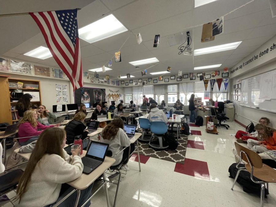 One classroom with a large roster size;  four different levels of journalism courses in one class period