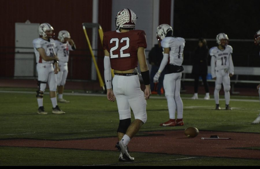 Captain Enzo Britez on the Olcott field during Senior Night