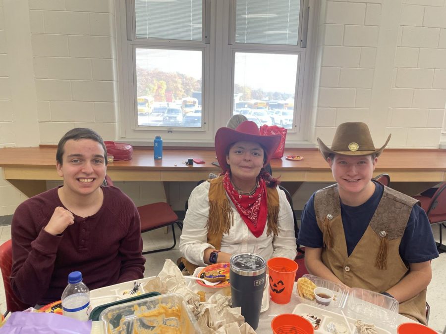 STAR students Stephane, Thomas, and Hudson celebrate the spooky season during their lunch party