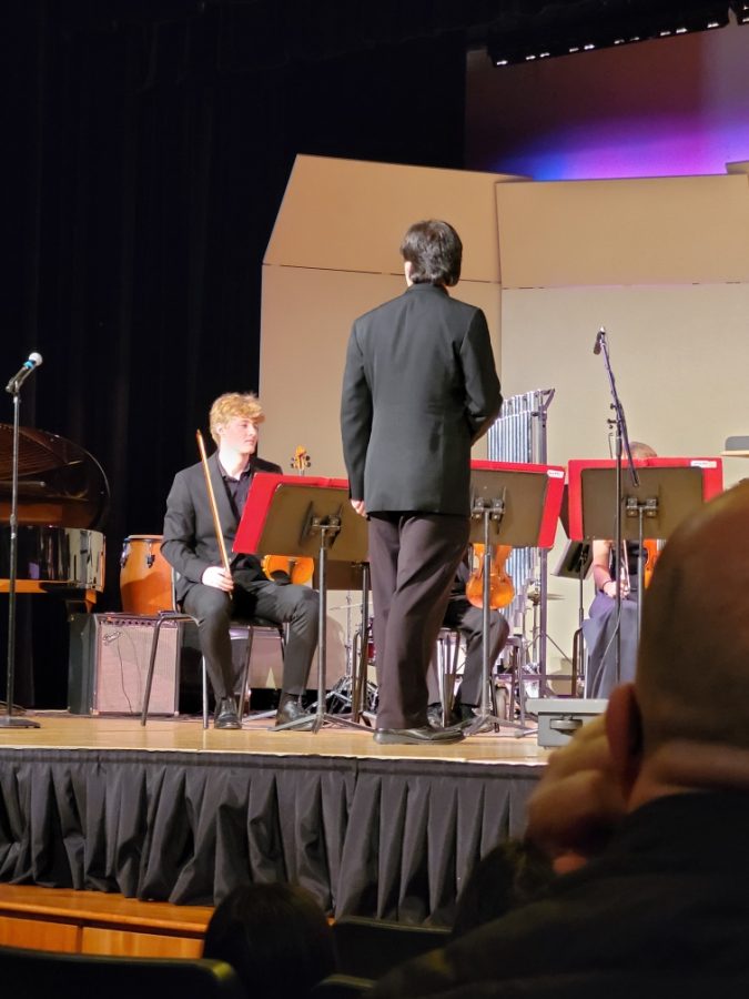 Mr. Teasler conducts the band at the Winter Holiday Concert