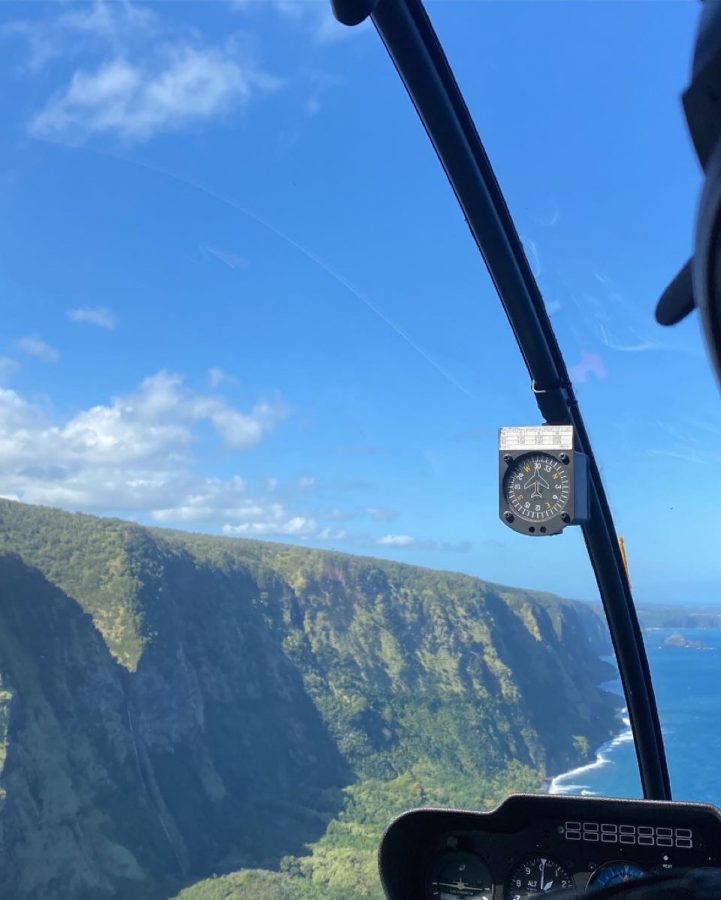 Picture of the beautiful Hawaiian water and clear blue sky from a helicopters view