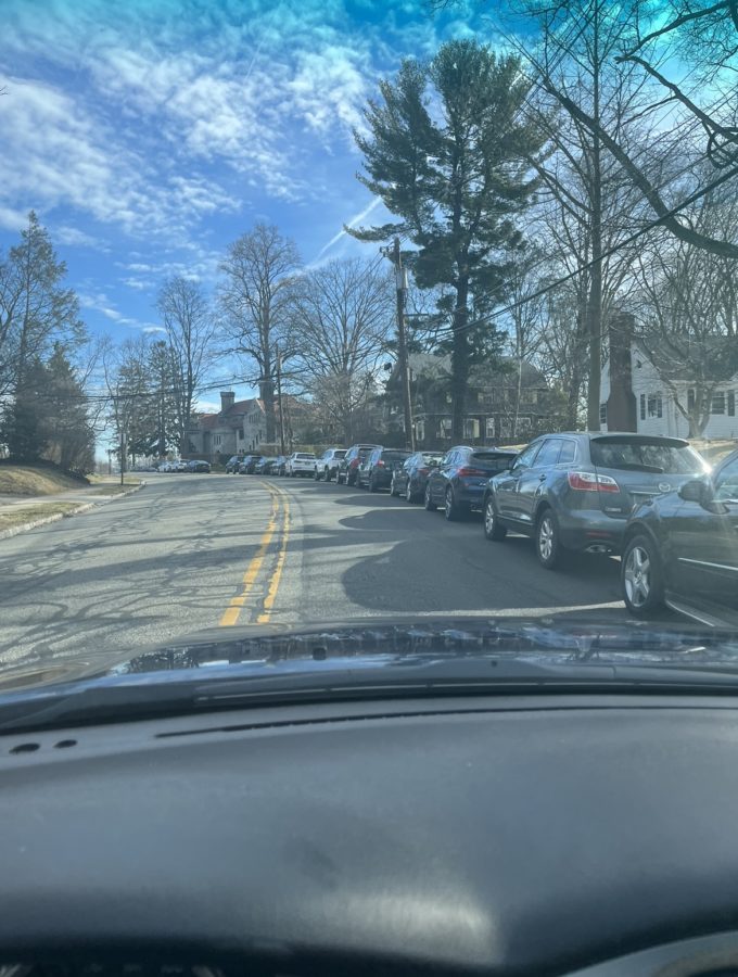 Several junior cars parked along Olcott Ave. early in the morning