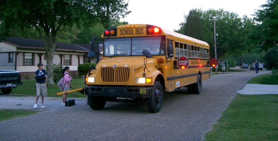 Students board the bus to go to school daily as main mode of transportation