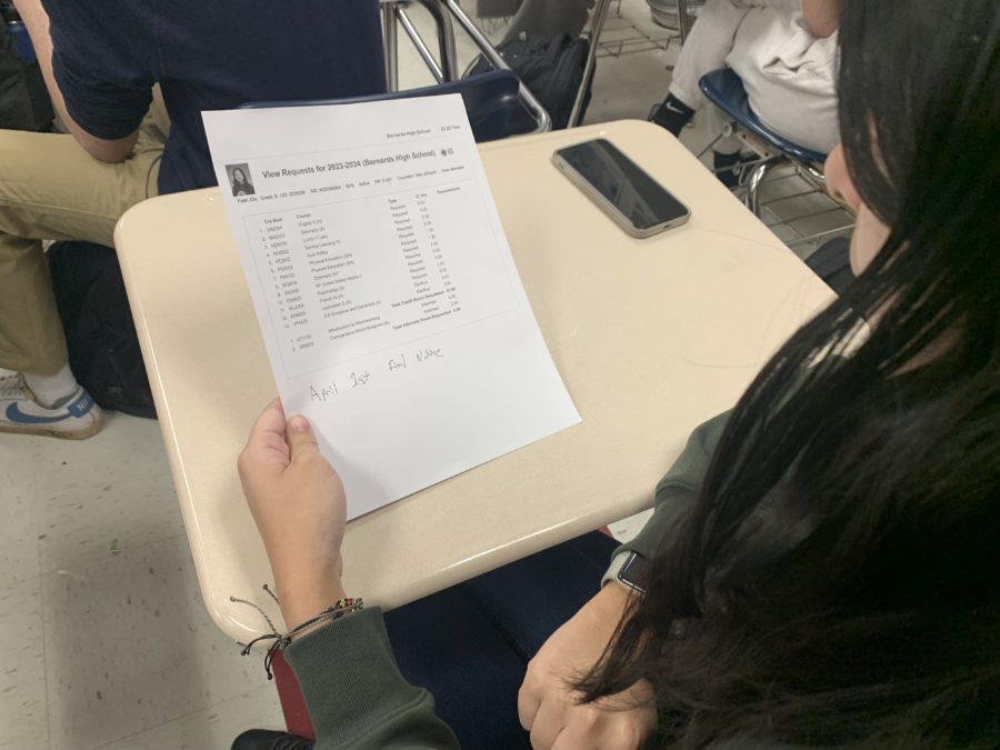 Ella Patel '26 looking at her next year's schedule