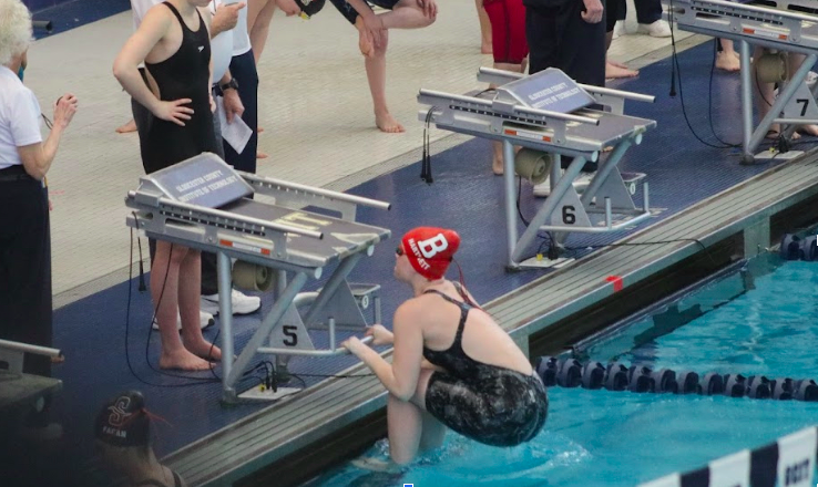 Junior Ashley Hartnett getting into beginning position to begin her regular season race