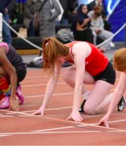 Senior Sydney Osborne forms her beginning position as she prepares to race