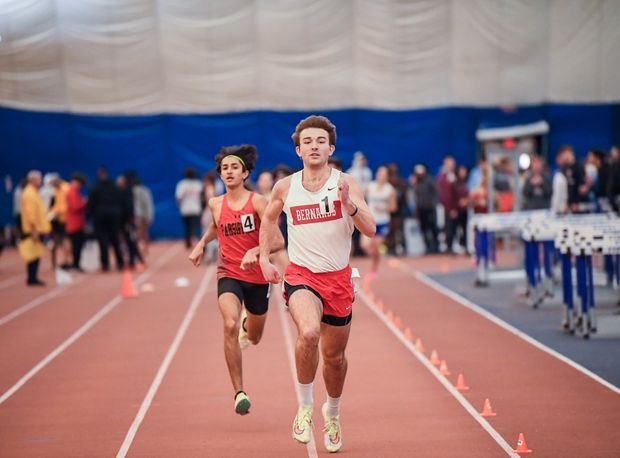 Pat Griffen runs to the finish line during the track meet