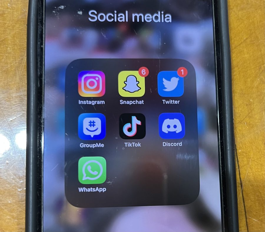 high school students iPhone screen container of various social media apps