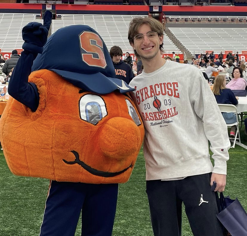 Matt Lesnick poses with Otto the Orange in Syracuse  New York