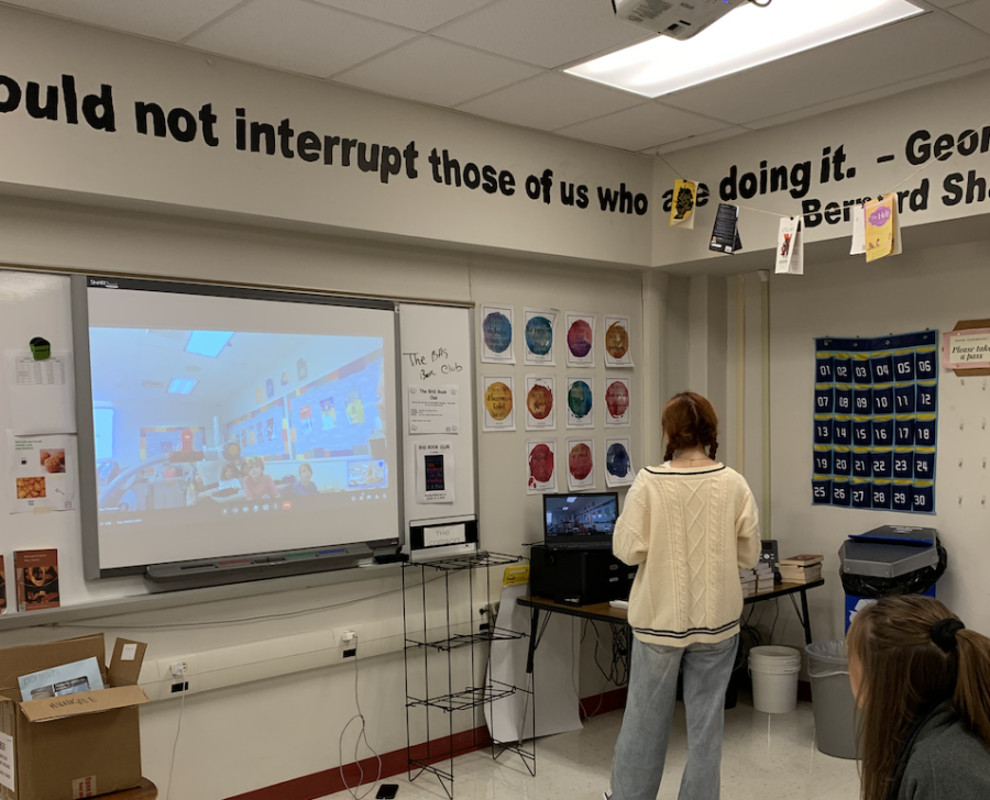 Meghan Shelley teaching elementary students how to conduct a opinion article