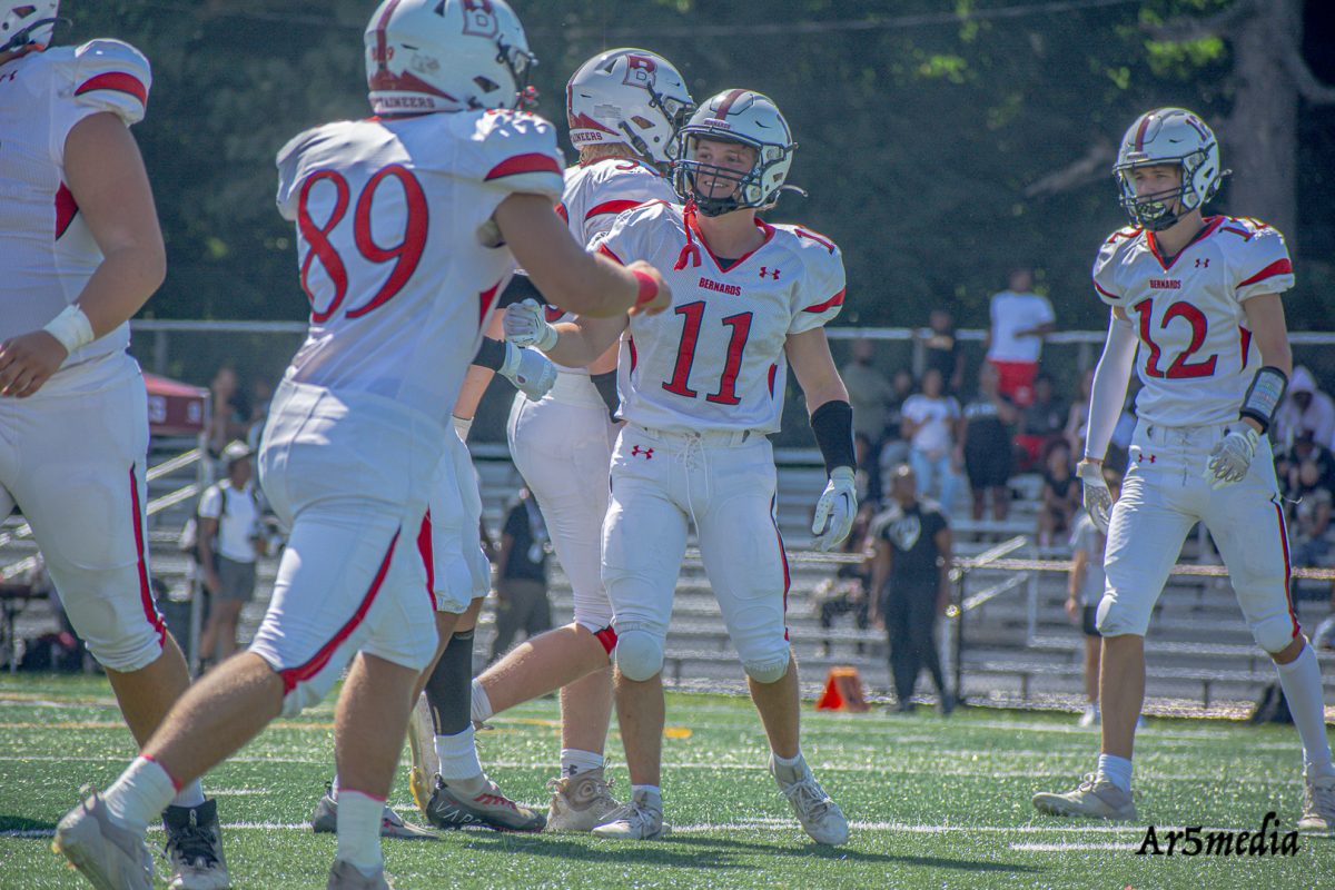 Senior Milo Disabato Celebrates After a big play during Coach SImoneau's 100th win. 