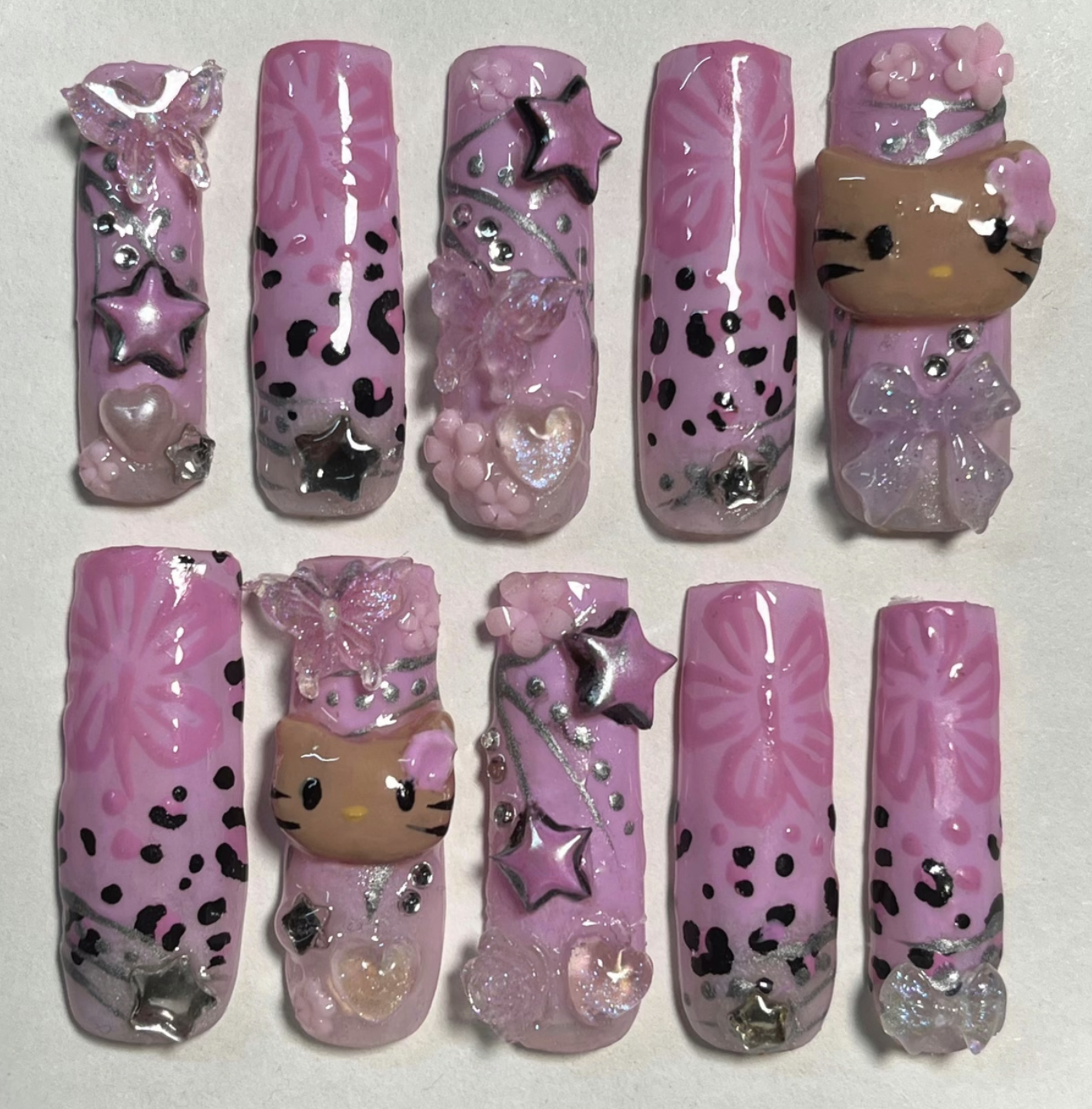 One of Kylies nail sets, with a pink Hello Kitty theme