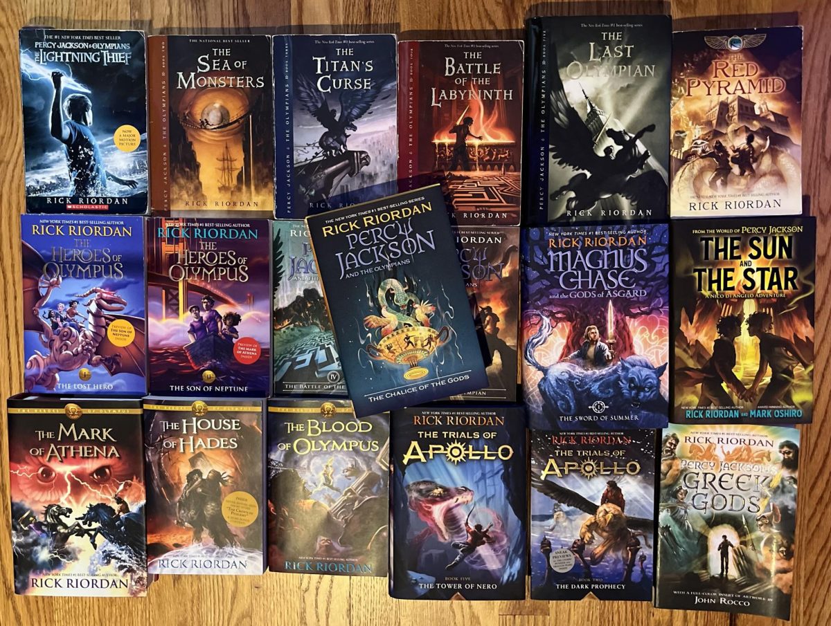 Collection of Rick Riordan's books with "Chalice of God" on top 