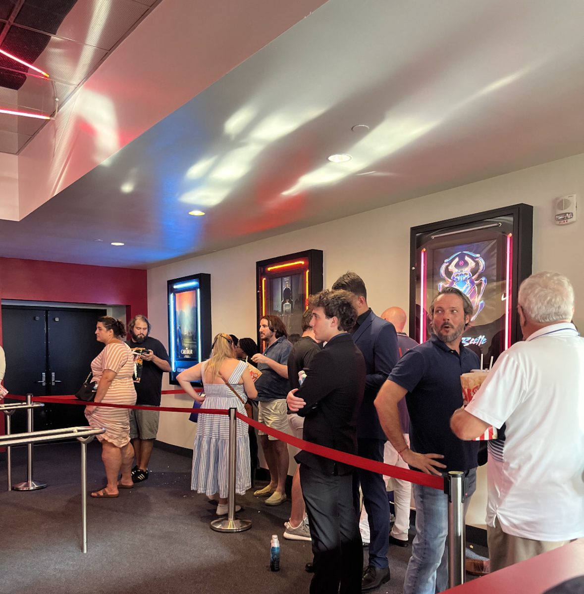Moviegoers wait in line to see Oppenheimer at the AutoNation IMAX Theater in Fort Lauderdale, FL.