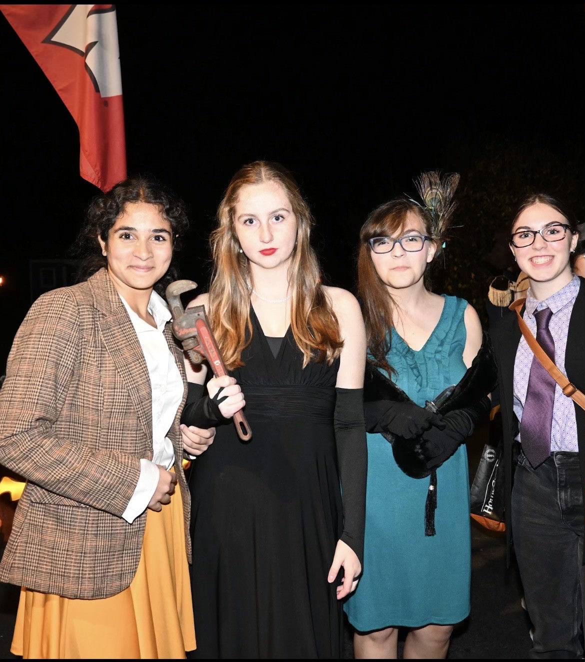 A group of students dress up as famous murder mystery game Clue characters 
