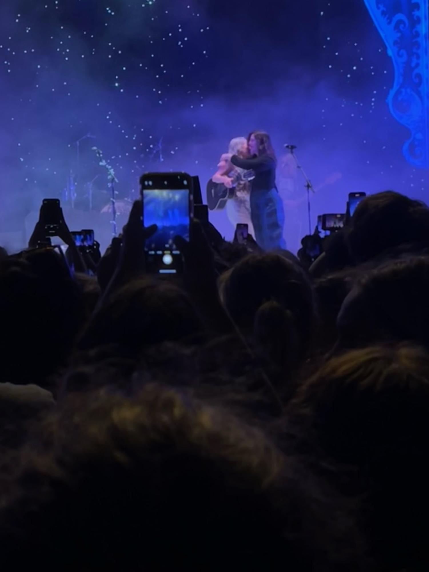 Pheobe Bridgers and Lucy Dacus of boygenius embrace during a live performance