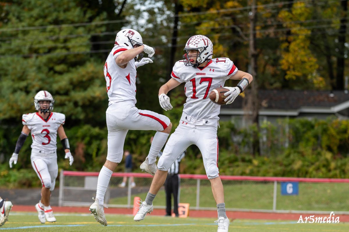 Juniors Brandon Shafer and Aidan Gribben getting together after a big touchdown against Govener Livingston 