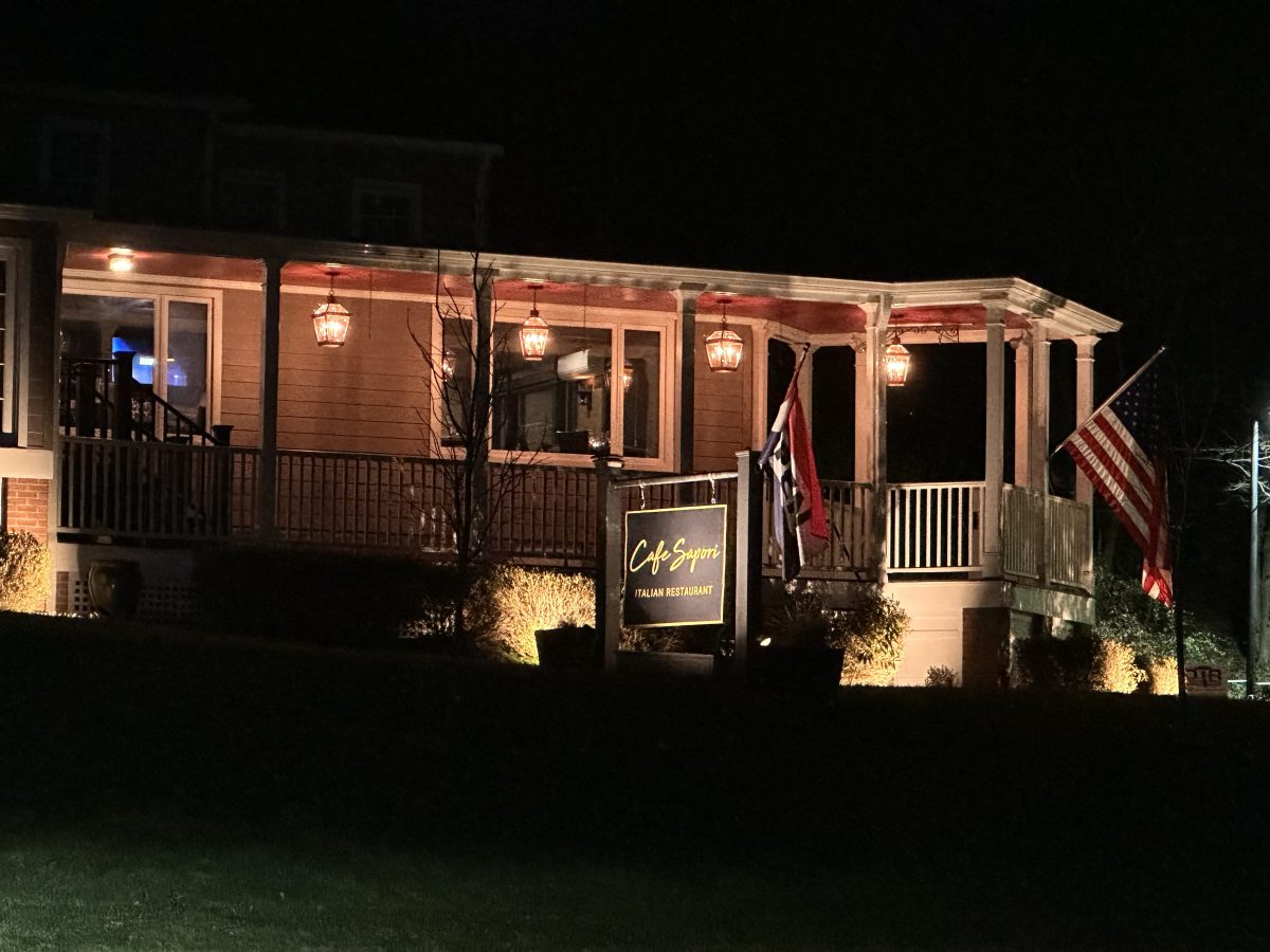 Cafe Sapori in the Harding Town Center lit up for night-time customers.