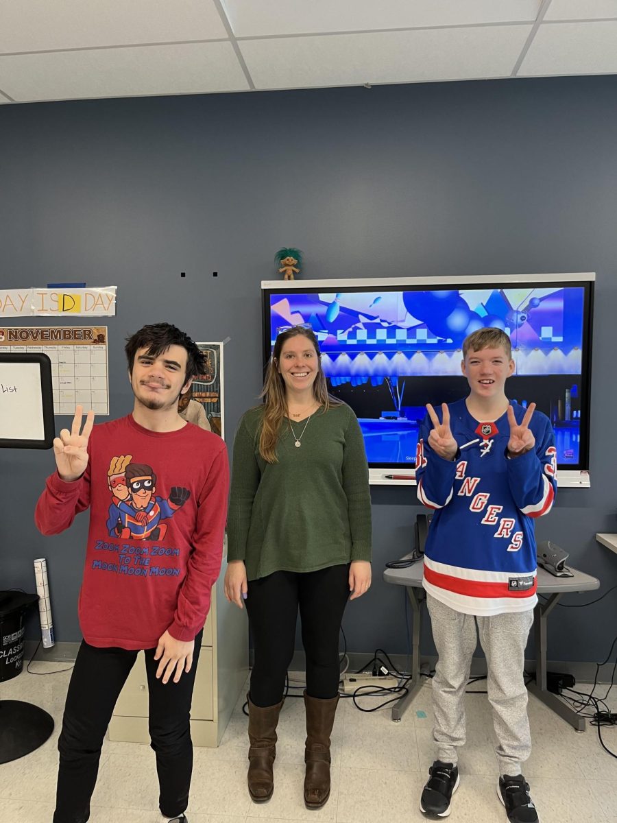 Two members of the unified bowling team with Coach Ms. Hart. 