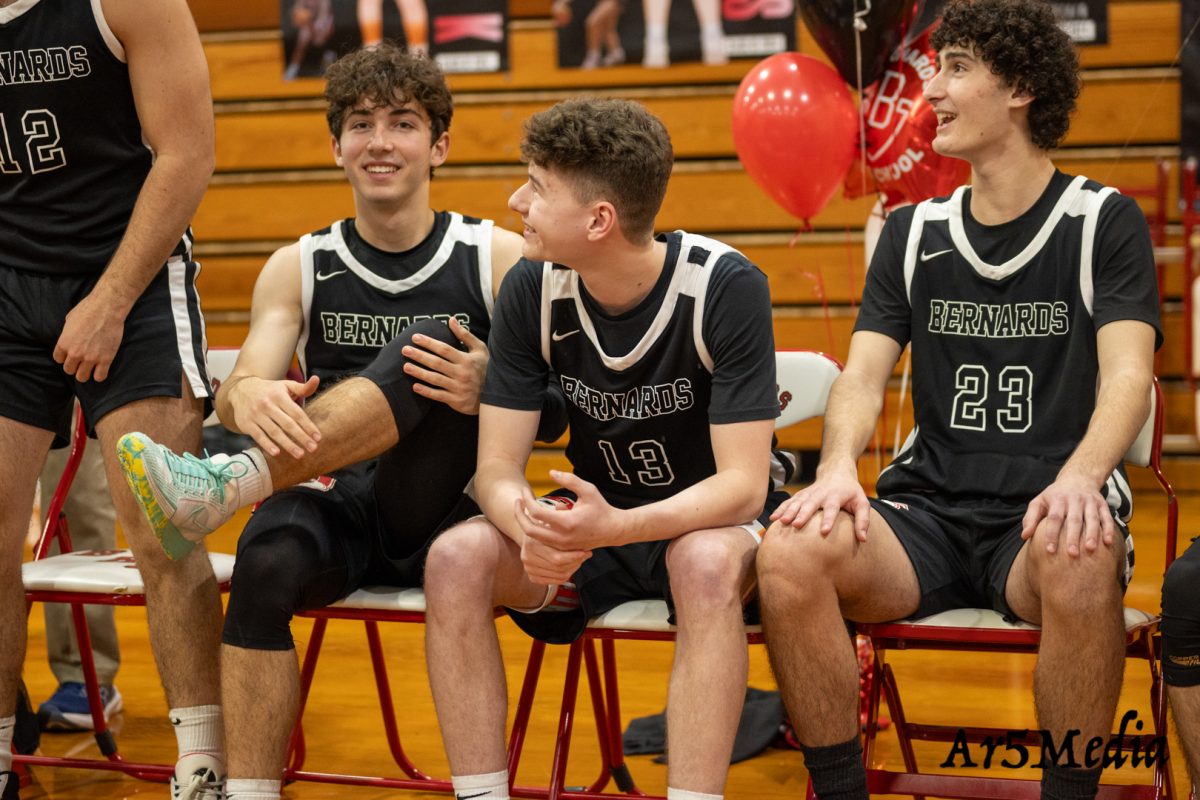Seniors laughing before being introduced on senior night 