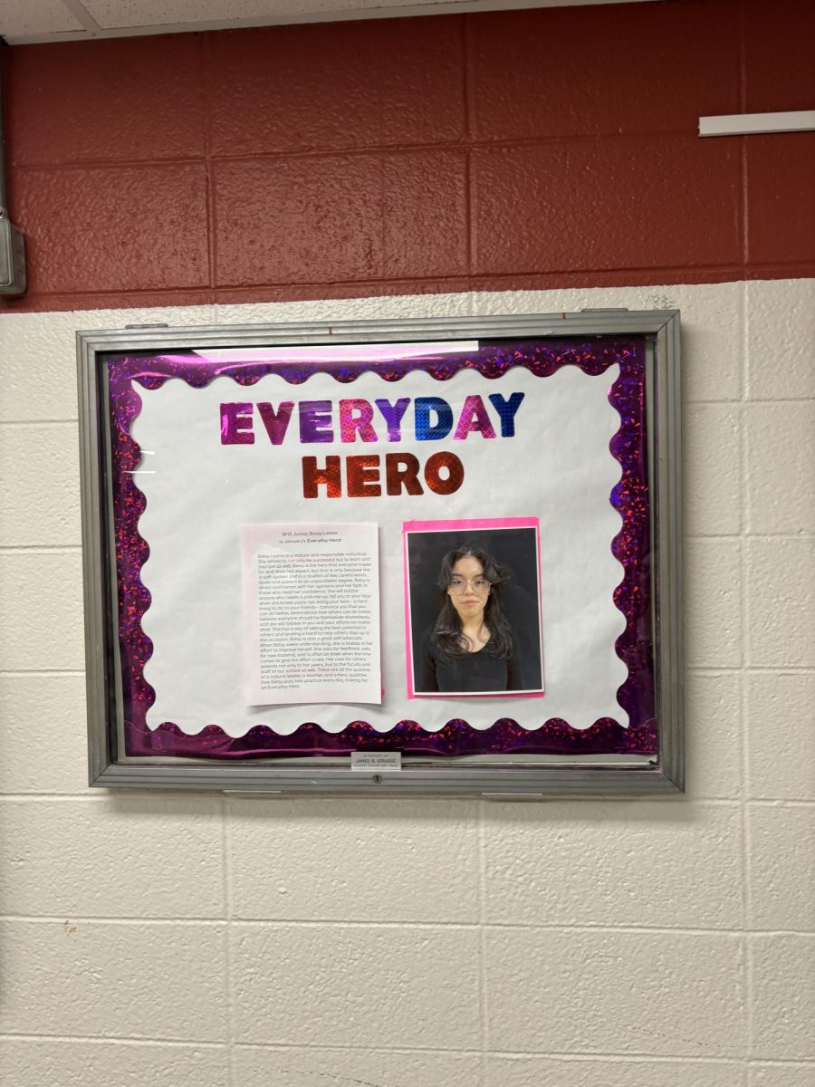 A poster celebrating Betsys Everyday Hero Award hangs in the B-wing