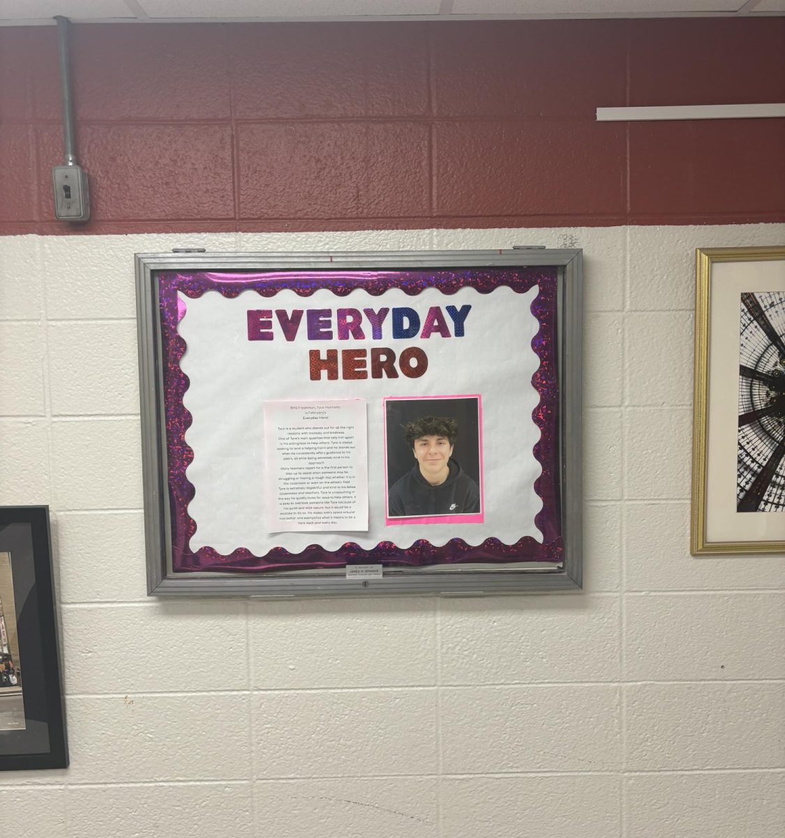 Tyce's Everyday Hero award is on display in the English hallway