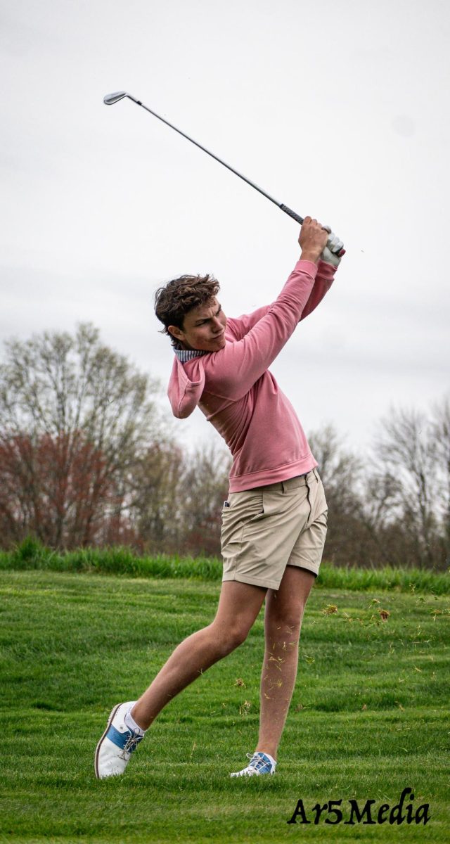 Noah Ocahb looking at his ball after a hit against Morristown 