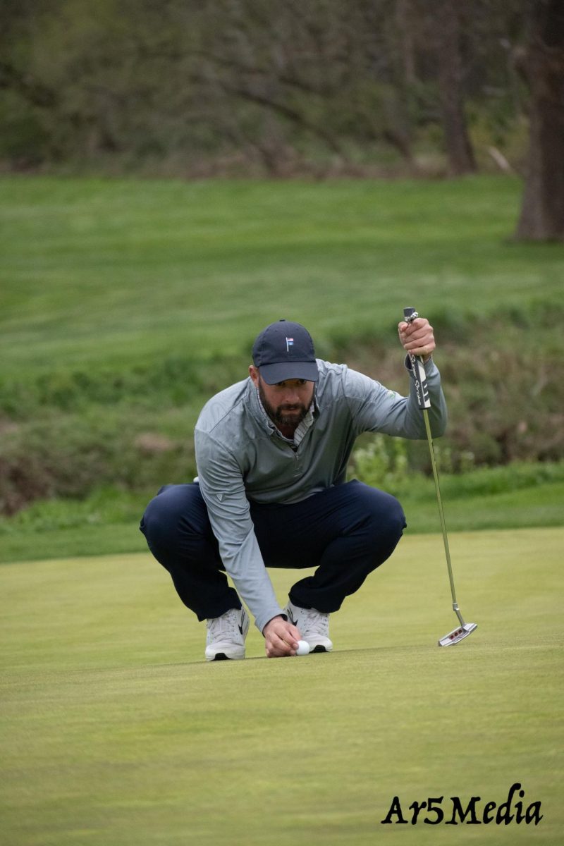 Coach Spautz reading the green playing behind the team against Morristown 