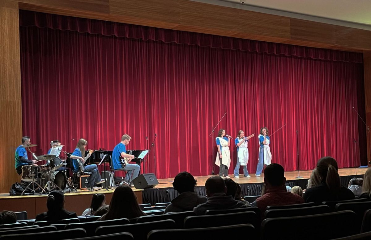 As the opening song, Monique Kafala-Dori, Maddie Bozack, and Gabby DeNicola perform "The Gospel Truth" from Hercules. 