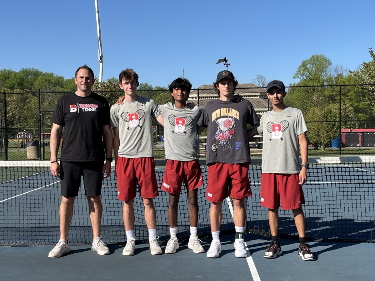 Seniors on the varsity tennis team after a big win on Senior Day.