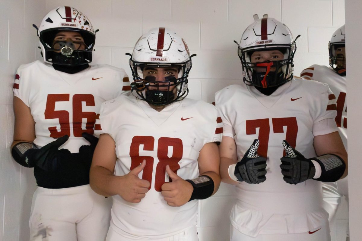 Senior Offensive Linemen James Renz, Finn Osborne and Justin Simpson pose before their division clinching win. Photo used with permission of dunnder_media