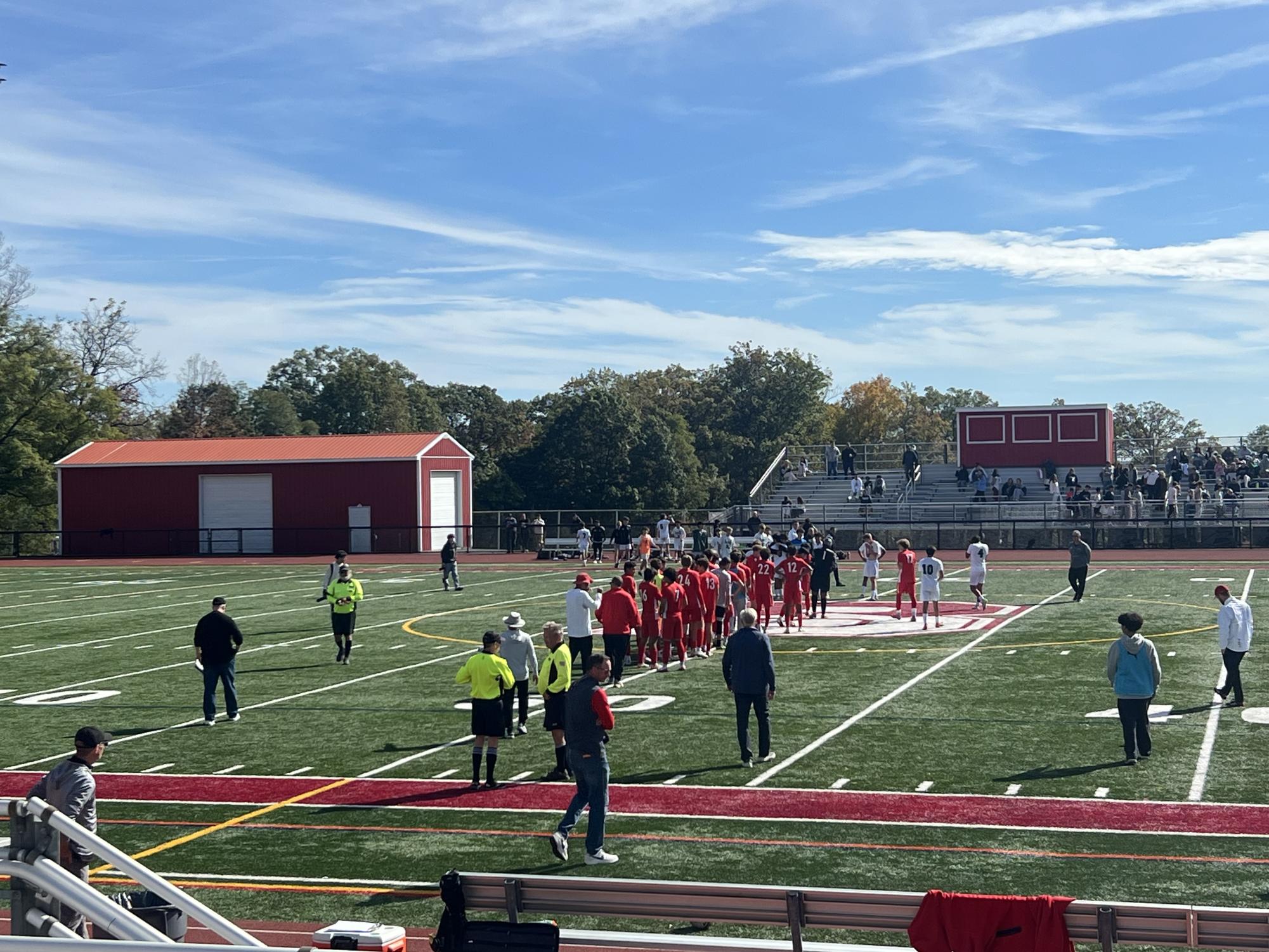 Teams shake hands following Bernards' win over Ridge in the county semifinals