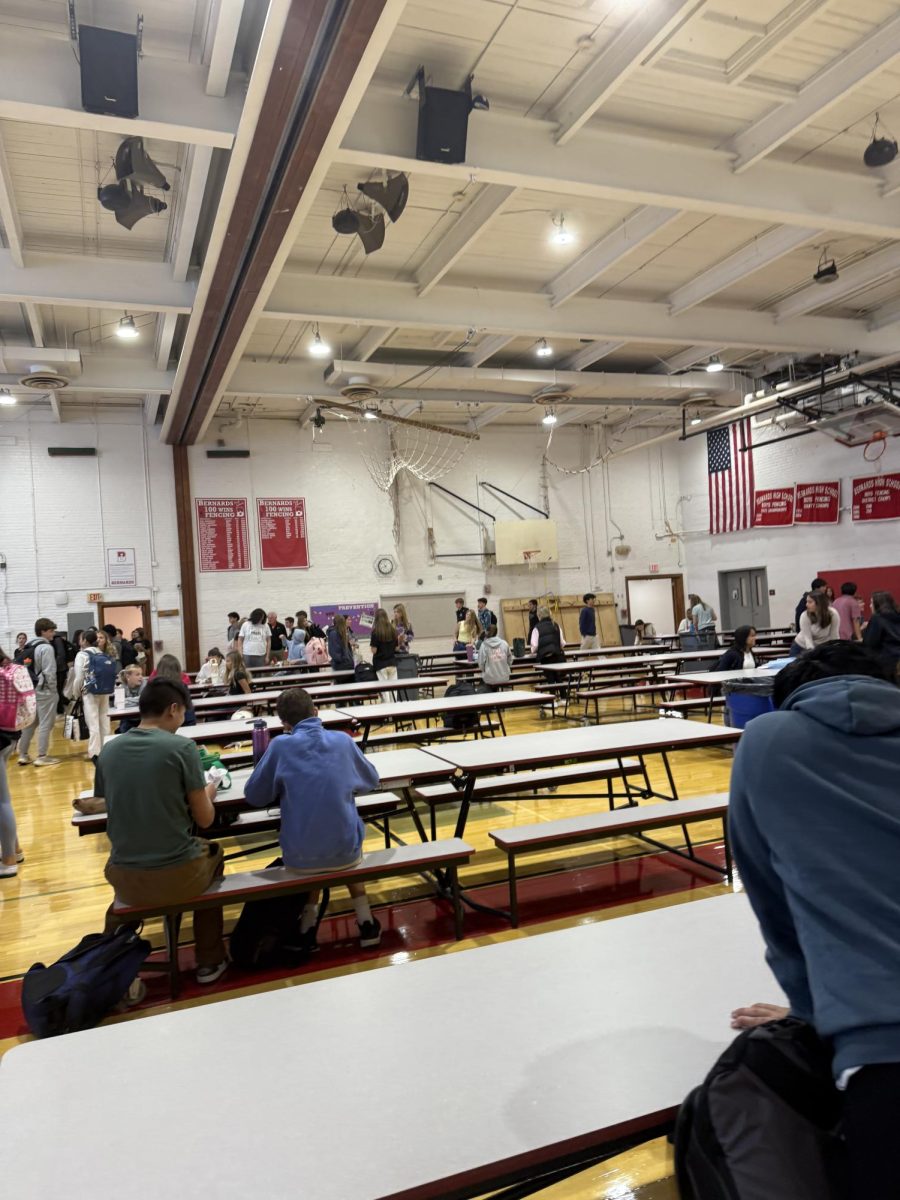 Students filing into one of the designated lunch spots, the upper gym.